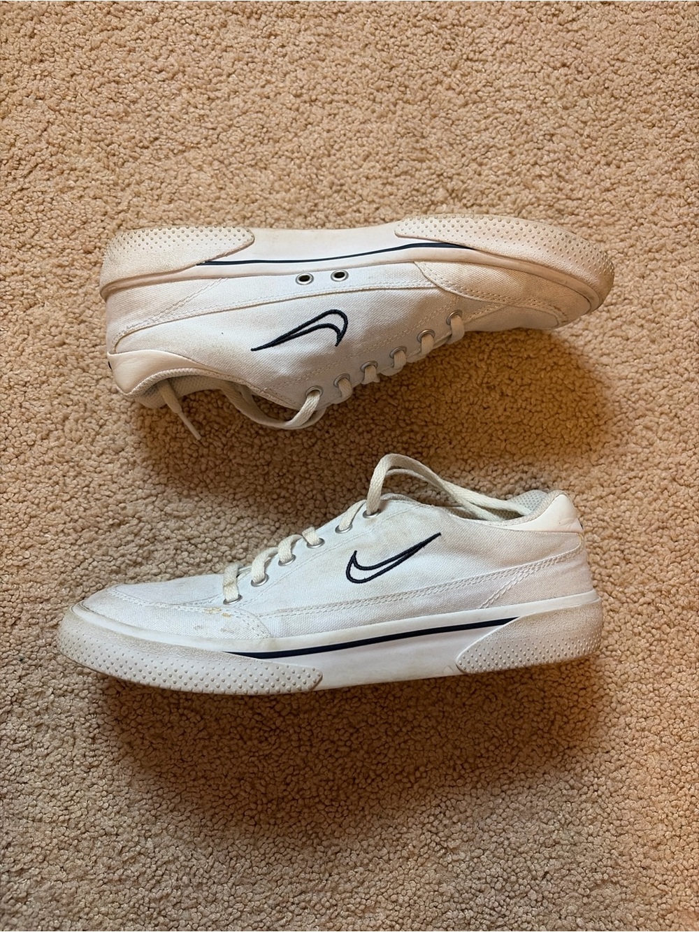 Nike Women’s White Low-Top Sneakers with Black Swoosh